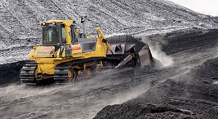 Komatsu bulldozer pushing coal in Power plant Ljubljana (winter 2017).jpg