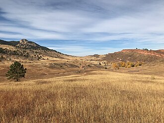 Arthur's Rock and the red sandstone escarpment of the Ingleside Ridge frame this view of the southeast corner of Lory State Park. Lory State Park scene.jpg