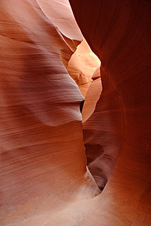 Red sandstone interior of Lower Antelope Canyon, Arizona, worn smooth by erosion from flash flooding over thousands of years Lower antelope 2 md.jpg