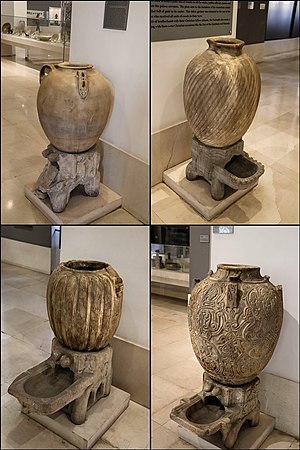 Marble jars and stands with engraved ornamentation