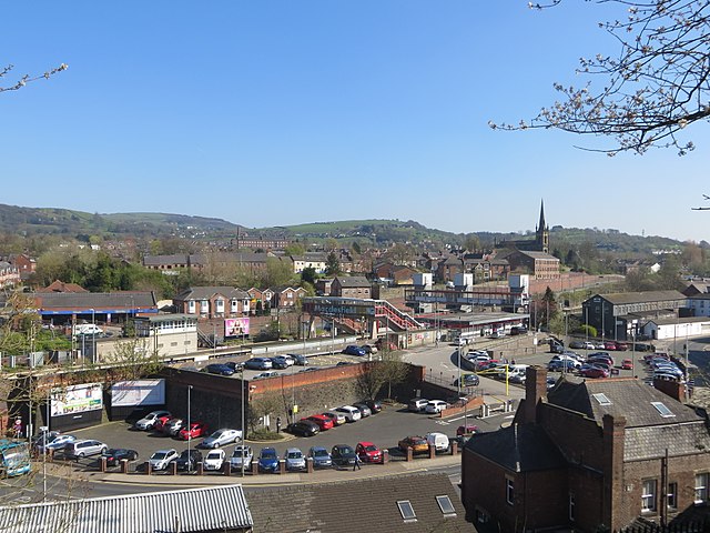 Skyline of Macclesfield with the railway station in the foreground, the spire of St Paul's Church in the background and townscape.