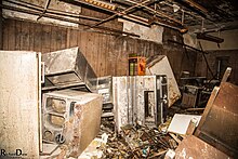 Retail on the bottom, apartments on top. Abandoned since the 1980s. Main Retail Building Interior 2.jpg