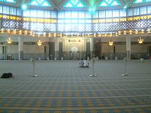 Interior of the national mosque of Malaysia. Neither Mormons nor Muslims permit drawings or photos inside their places of worship; the Mormons do allow some in the hallways and elsewhere outside of their chapels. Malaysia National Mosque inside.jpg