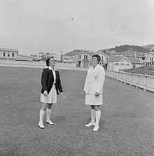 Mary Duggan and Rona McKenzie, tossing a coin, 1957.jpg
