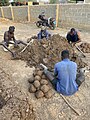 Mounding and building a thatch house in Northern Ghana 04