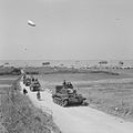 A Cromwell tank leads a column of armour from 4th County of London Yeomanry, 7th Armoured Division inland from Gold Beach, 7 June 1944