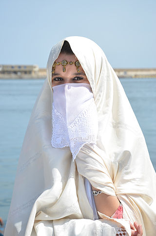 Algerian woman wearing a traditional cloth called a haik
