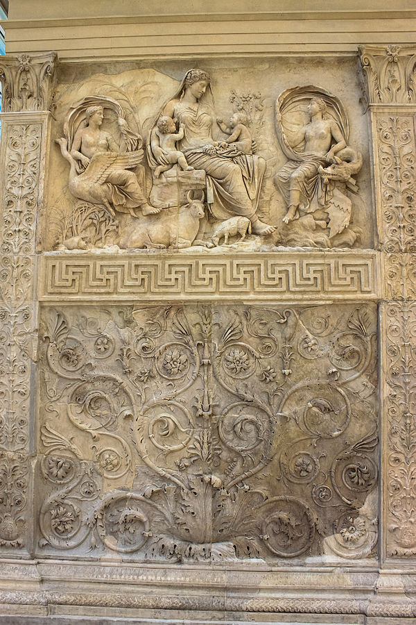 The "Tellus Panel" from the Ara Pacis, Rome, c. 27 AD. A spreading scrollwork panel below, scrolling forms coming off a straight stem in the side pane