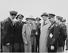 President Harry S. Truman with Secretary of the Air Force Stuart Symington and Chief of Staff of the Air Force Hoyt Vandenberg Photograph of President Truman with Secretary of the Air Force Stuart Symington and a number of military officers, at... - NARA - 200087.jpg