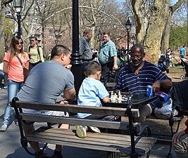 A child playing chess in Washington Square Park