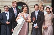 Princess Estelle's Baptism – From left to right: Olle Westling, King Willem-Alexander of the Netherlands, Princess Estelle on her mother's lap, The Duke of Västergötland, The Crown Princess of Denmark and Queen Silvia of Sweden (22 May 2012)