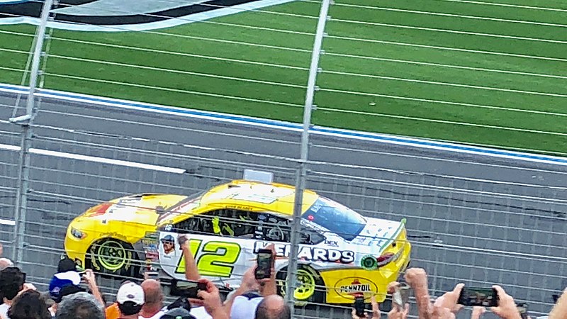 File:Ryan Blaney drives to the finish line in the opposite direction after winning the 2018 Bank of America 400.jpg