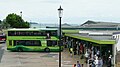 English: Ryde bus station and Ryde Esplanade railway station, off Ryde Esplanade, Ryde, Isle of Wight, seen during August 2010. The bus is Southern Vectis Scania OmniCity 1102 (HW08 AOR).