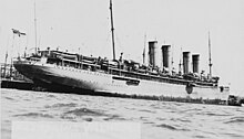 SMS Kronprinz Wilhelm, still flying the German naval ensign, interned in a US port, April 1915 SMS Kronprinz Wilhelm 2.jpg