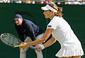 Stephanie Vogt competing in the first round of the 2015 Wimbledon Qualifying Tournament at the Bank of England Sports Grounds in Roehampton, England. The winners of three rounds of competition qualify for the main draw of Wimbledon the following week.