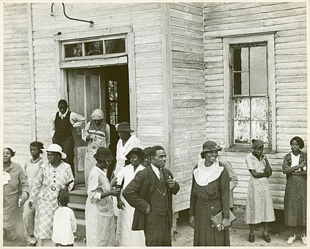 Outside of a black church in Little Rock, Arkansas, 1935. Sunday in Little Rock, Ark., 1935. (3109755087).jpg