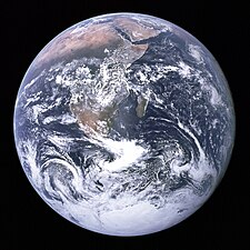 "The Blue Marble" photograph of Earth, taken by the Apollo 17 mission. The Arabian peninsula, Africa and Madagascar lie in the upper half of the disc, whereas Antarctica is at the bottom.