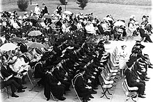 The graduation ceremony (held in 1966) was held out of doors, a feature of the open-air ceremony of the 1960s. UOW Graduation Day in 1966.jpg