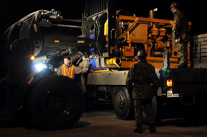 File:US Navy 110317-F-YC711-074 U.S. Air Force Airmen and members of the Japan Ground Self-Defense force load high-capacity pumps provided by the U.S. N.jpg