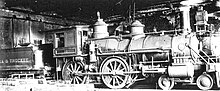 Virginia & Truckee RR 12, "Genoa," in its 20th-century configuration (e.g., straight stack, round headlight, etc.), before restoration. Virginia & Truckee RR 12, "Genoa." Carson City Engine House (before restoration).jpg