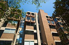 Excessive sunlight is handled here with shades of various colors, paper taped to windows, and, at the far right, what appears to be the backs of bookshelves placed against windows. WTP2 Mike Reali 01b.jpg