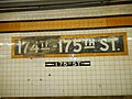 A standard mosaic, with a smaller directional mosaic pointing to the now closed 175th Street entrance/exit.