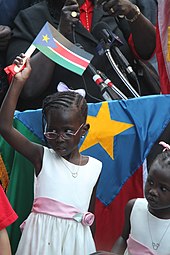 A South Sudanese girl at independence festivities A South Sudanese girl at independence festivities (5926735716).jpg