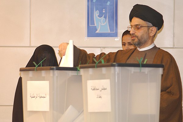 Abdul Aziz al-Hakim, leader of the Supreme Council for the Islamic Revolution in Iraq, casts his ballot at a poll station in Baghdad in the January, 2