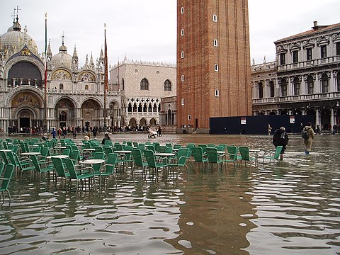 Tidal flooding. Sea-level rise increases flooding in low-lying coastal regions. Shown: Venice, Italy (2004).[212]