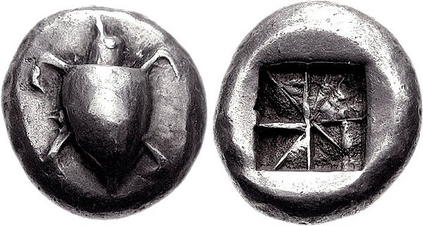 Silver stater of Aegina, 550–530 BC. Obv. Sea turtle with large pellets down centre. Rev. incuse square punch with eight sections.