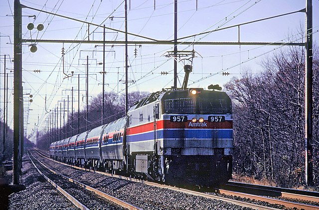 Amtrak E60CH #957 leads a northbound train through Bowie, Maryland, in December 1980