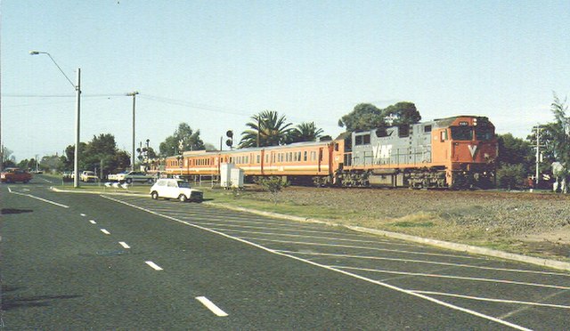 N class in the original orange and grey livery hauling H type carriages at Geelong in 1993