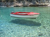 Boat on clear water at island Šolta.jpg