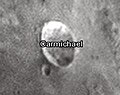 English: Carmichael lunar crater as seen from Earth with satellite craters labeled