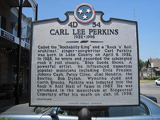 Historic marker commemorating Perkins alongside other famous peers