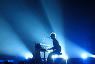 Chris Martin playing "The Scientist" on his piano during the band's 2005 Twisted Logic Tour Chris Martin piano Barcelona 2005.jpg