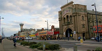 Marine Parade in August 2013, with the derelict Empire Building in the foreground and the Great Yarmouth Tower in the background Cmglee Great Yarmouth Empire Atlantis.jpg