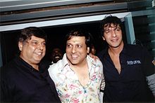 Left to right, David Dhawan, Govinda, and Chunky Pandey at a birthday party for Bobby Deol David Dhawan Govinda Chunky Pandey still3.jpg