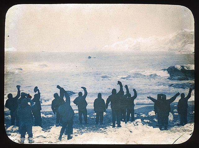Elephant Island party waving goodbye to sailors on the James Caird, 24 April 1916