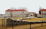 Remnants of the old fort with the new Fort Frontenac in background