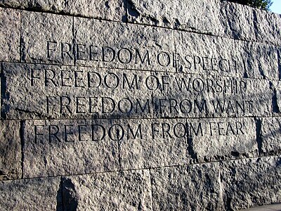 A memorial wall engraved with the Four Freedoms.