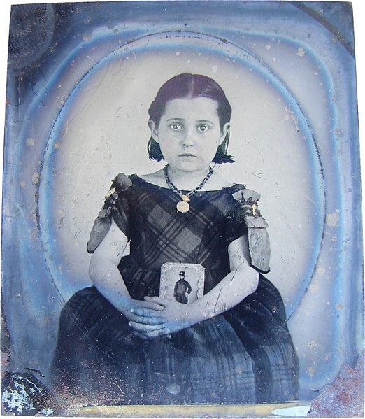 File:Girl in mourning dress holding photograph of her father as a cavalryman, 1860s (7913860146).jpg