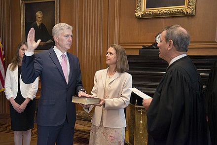 Gorsuch being administered the first oath of office in a private ceremony by Chief Justice John Roberts