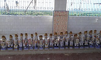 Idols at the temple on Kakadbhit hill Idols of Jakh Botera (Kutch folk deities) at Kakadbhit, Kutch, Gujarat, India.jpg