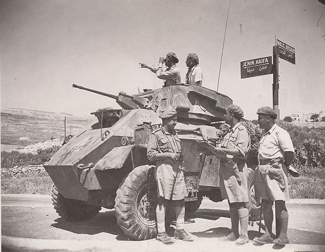 Iraqi army troops led by Taher Abdel Ghafour and with a Humber Armoured Car in the city of Jenin, 1948.