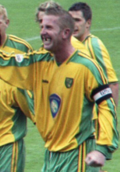 Roberts celebrating after scoring a goal for Norwich City in 2004