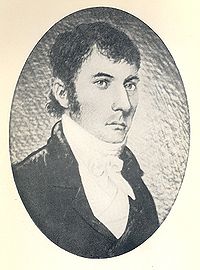 Głowa i ramiona owalny portret poważnego i godnego człowieka w jego trzydziestych lub czterdziestych, z ciemnymi włosami, ogolony na sobie krawat.