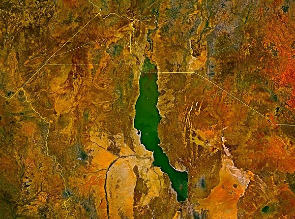 Satellite image of Lake Turkana, distinguishable from its jade color. The Omo River enters at the top. The river visible on the lower left is the Turk