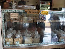 Lavosh sold at the Kanemitsu Bakery counter in Molokai, Hawaii. Flavors offered include Maui onion, sesame, taro and cinnamon. Lavosh as Kanemitsu Bakery.jpg