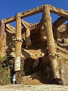 Exposed foundations in the Sandstone Cliffs from a 2014 erosion event. Levitating the Parthenon (13837337384).jpg